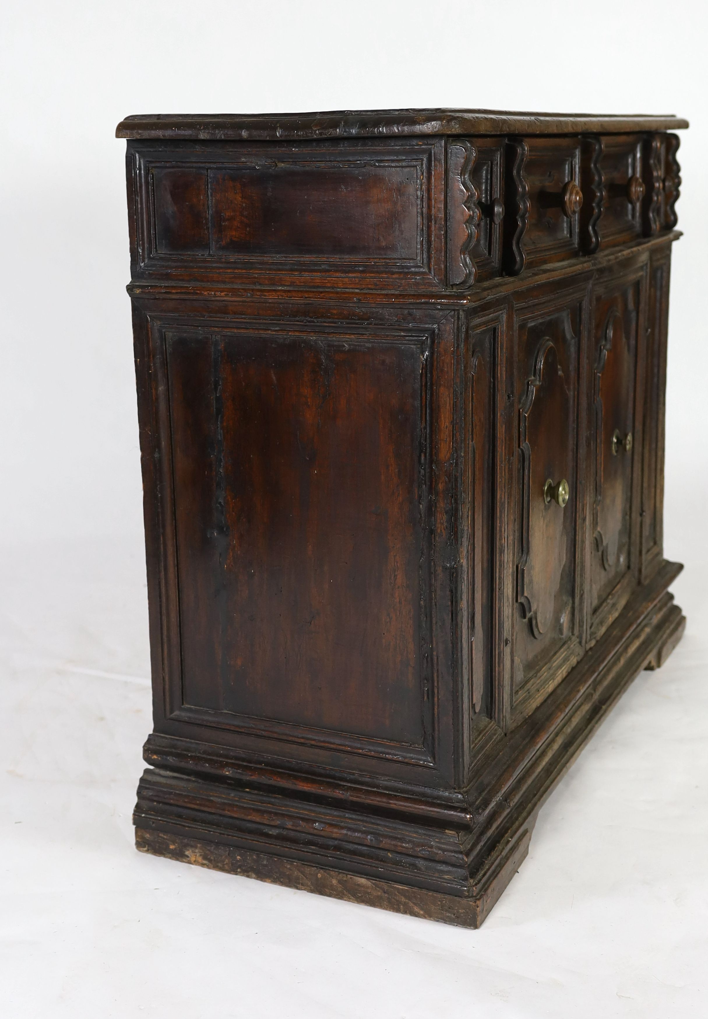 A 17th century Tuscan walnut credenza, W.131cm D.52cm H.105cm